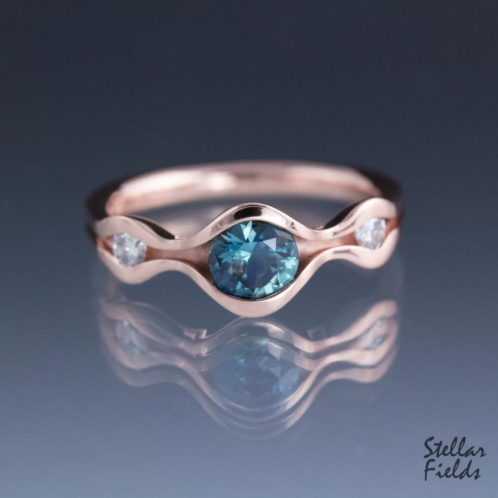 Three Stone Wave Engagement Ring with Teal Montana Sapphire & Canadian Arctic Diamonds